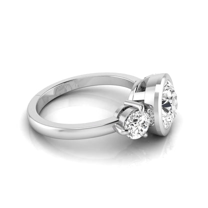 Round cut lab grown diamond three stone engagement ring with a bezel set center diamond and round side diamonds in white gold