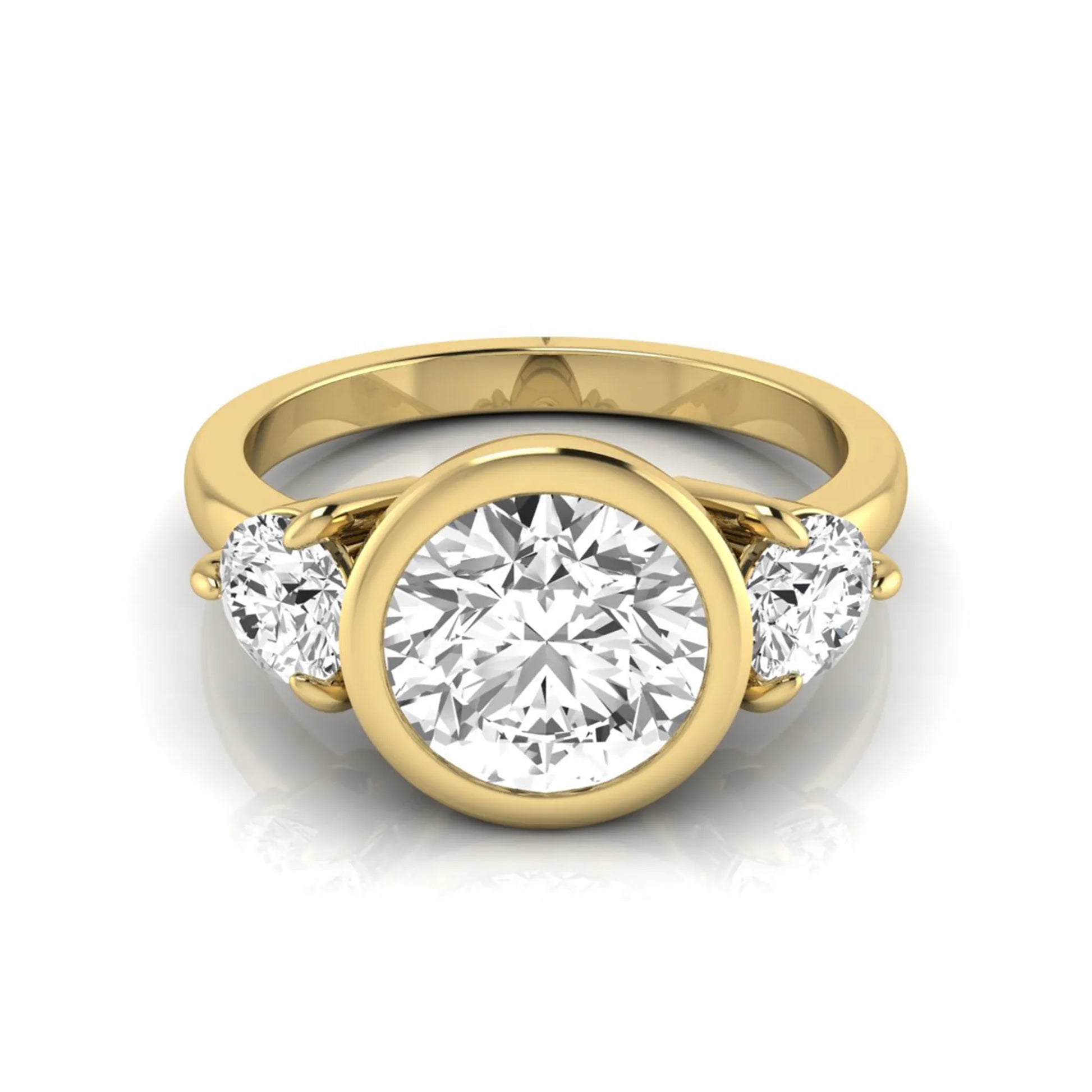 Round cut lab grown diamond three stone engagement ring with a bezel set center diamond and round side diamonds in yellow gold
