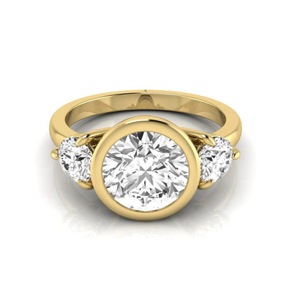 Round cut lab grown diamond three stone engagement ring with a bezel set center diamond and round side diamonds in yellow gold