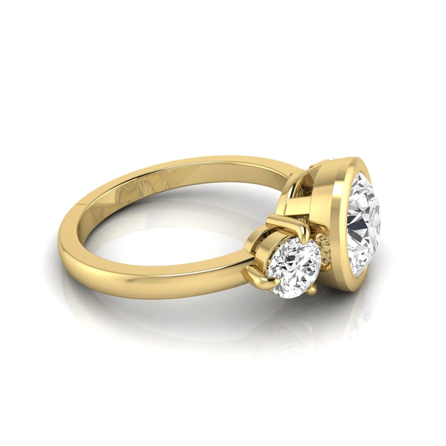 Round cut lab grown diamond three stone engagement ring with a bezel set center diamond and round side diamonds in yellow gold