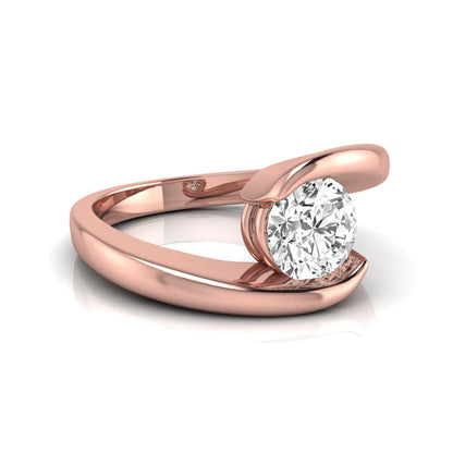 Round cut lab grown diamond solitaire engagement ring featuring a modern bypass rose gold band with an IGI certified center diamond.
