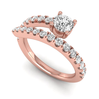Round cut lab grown diamond bypass engagement ring with round pavé accent diamonds in a four-prong setting in rose gold