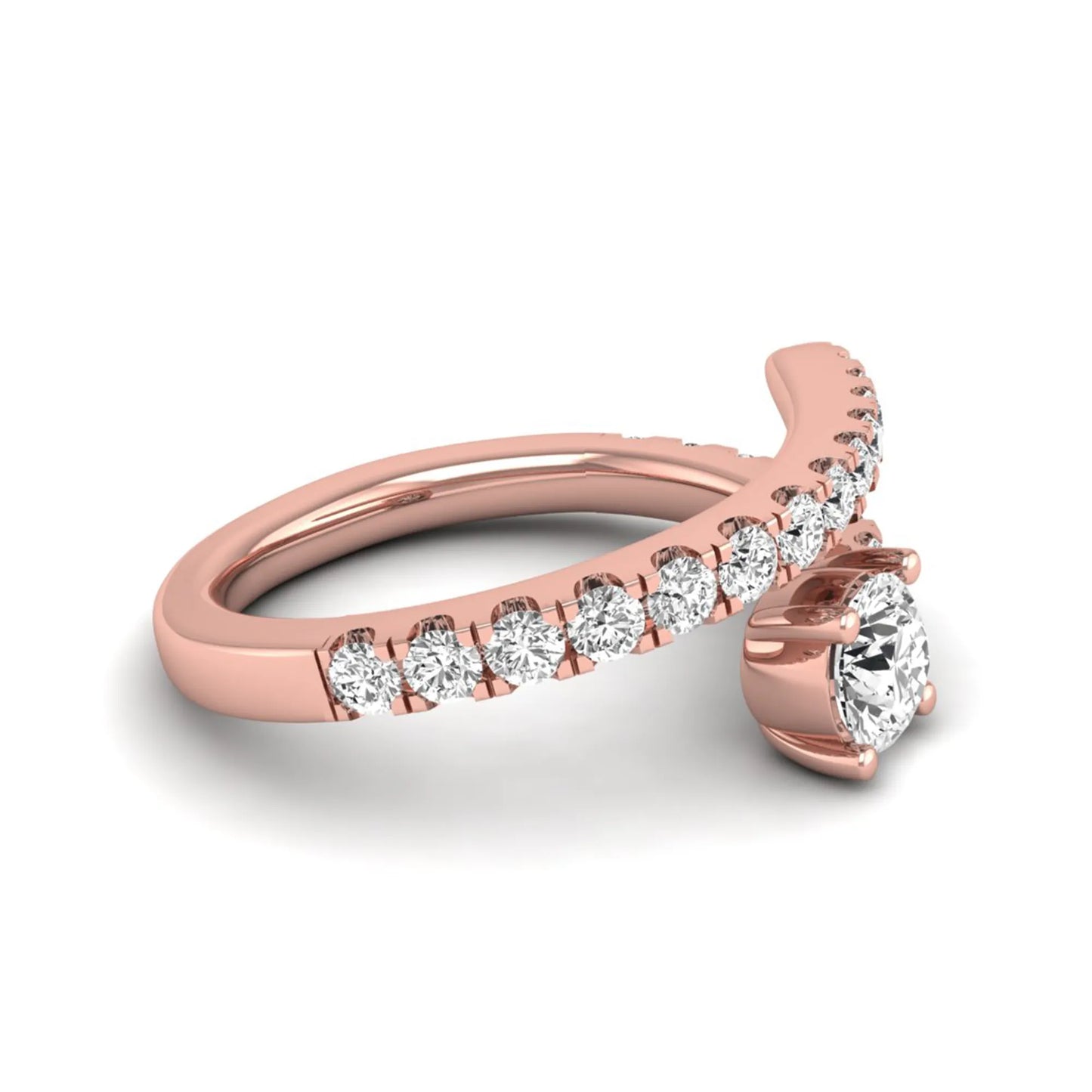 Round cut lab grown diamond bypass engagement ring with round pavé accent diamonds in a four-prong setting in rose gold