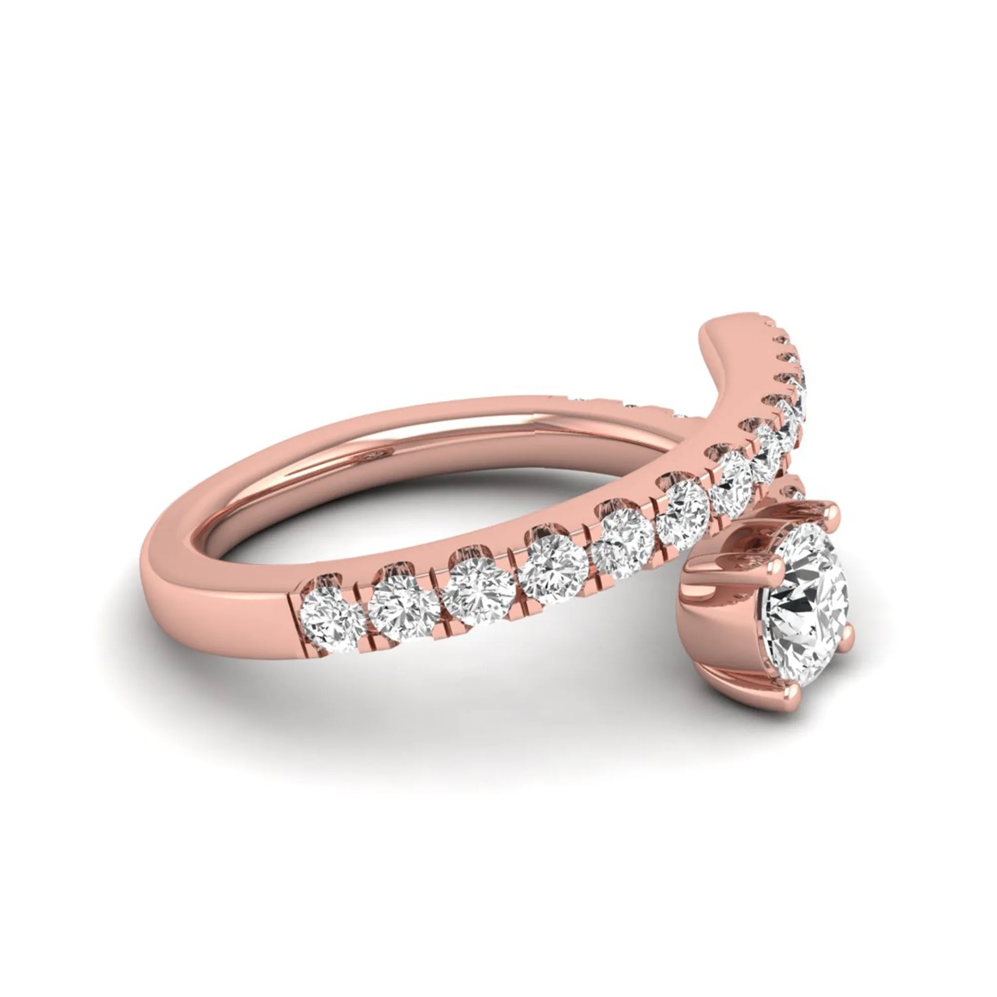 Round cut lab grown diamond bypass engagement ring with round pavé accent diamonds in a four-prong setting in rose gold