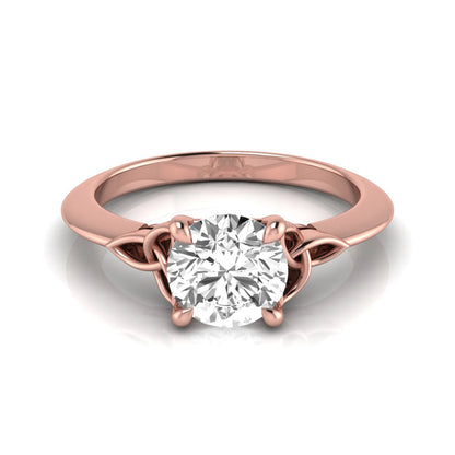 Round cut IGI certified lab grown diamond solitaire engagement ring featuring an elegant Celtic knot inspired gallery in a polished rose gold setting.