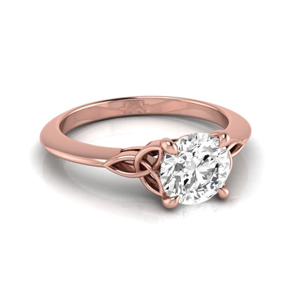 Round cut IGI certified lab grown diamond solitaire engagement ring featuring an elegant Celtic knot inspired gallery in a polished rose gold setting.