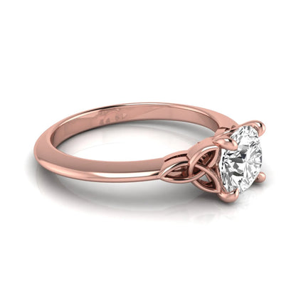 Round cut IGI certified lab grown diamond solitaire engagement ring featuring an elegant Celtic knot inspired gallery in a polished rose gold setting.