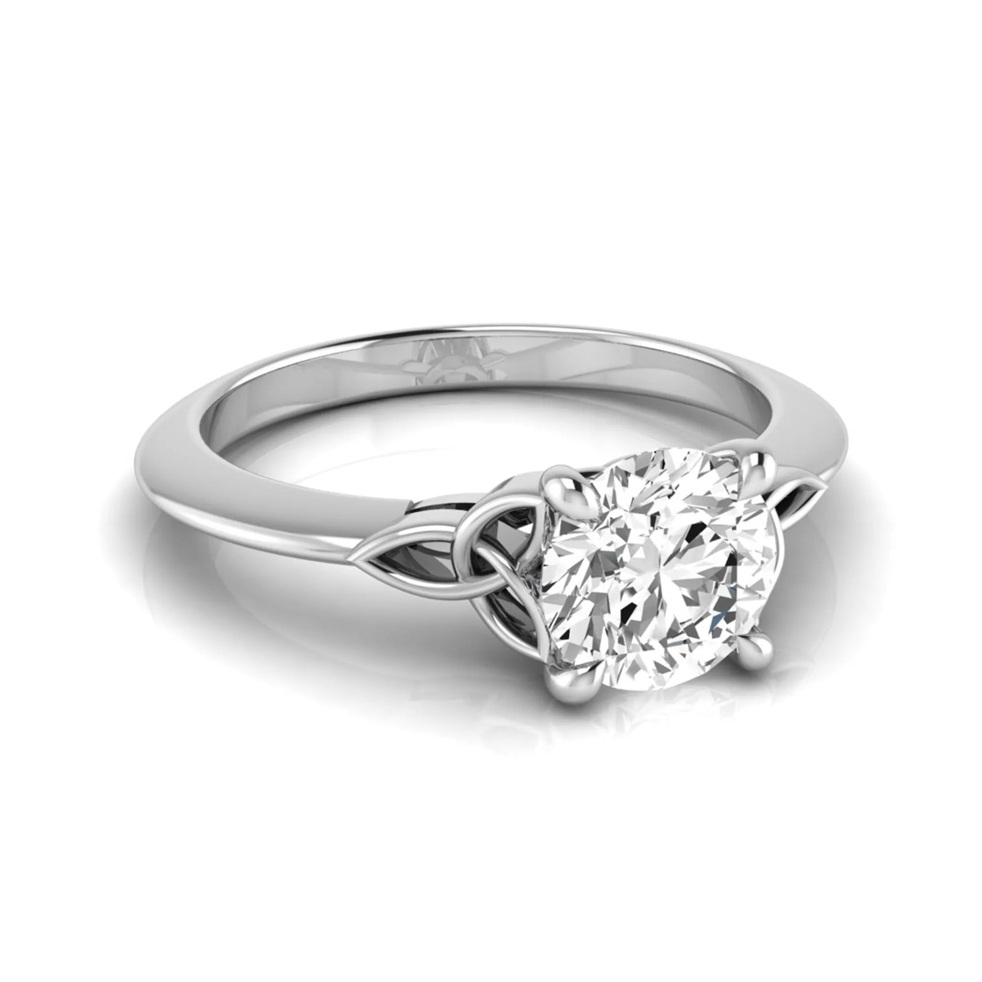 Round cut IGI certified lab grown diamond solitaire engagement ring featuring an elegant Celtic knot inspired gallery in a polished white gold setting.
