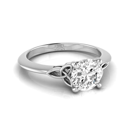 Round cut IGI certified lab grown diamond solitaire engagement ring featuring an elegant Celtic knot inspired gallery in a polished white gold setting.