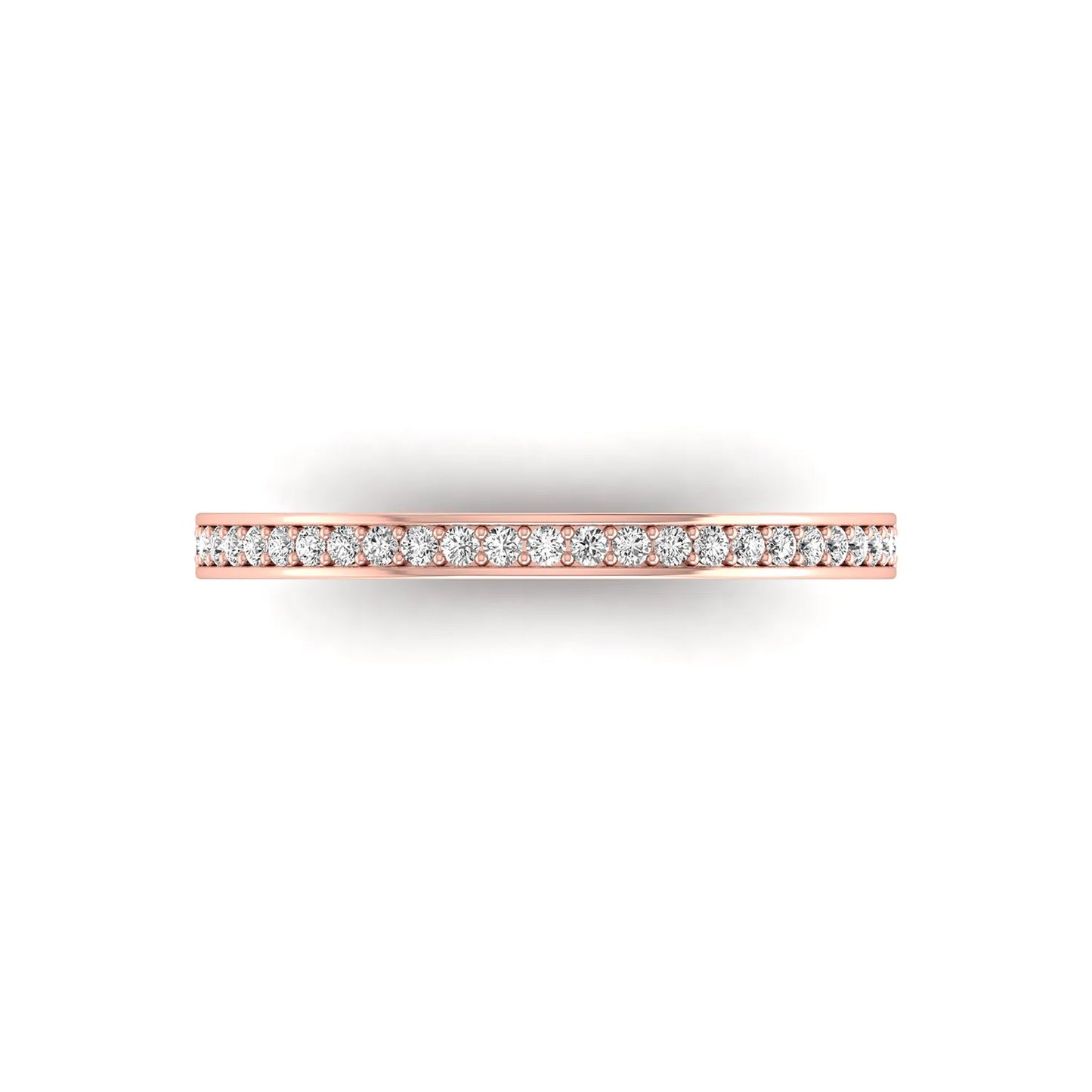 Round channel set lab grown diamond half eternity band ring featuring brilliant round diamonds in a slim stackable wedding band design in rose gold