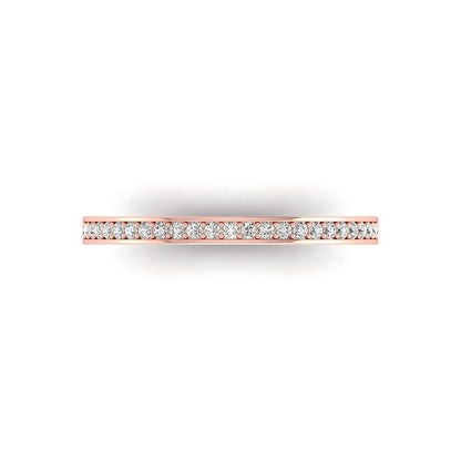 Round channel set lab grown diamond half eternity band ring featuring brilliant round diamonds in a slim stackable wedding band design in rose gold