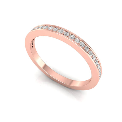 Round channel set lab grown diamond half eternity band ring featuring brilliant round diamonds in a slim stackable wedding band design in rose gold