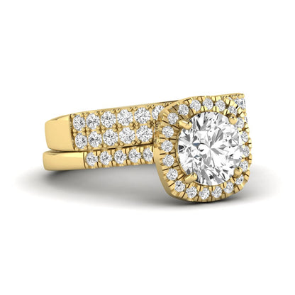 Round Cushion Halo Bridal Ring Set featuring an 8.00 mm round lab grown diamond with a cushion-shaped halo, pavé engagement ring, and matching pavé wedding band in yellow gold