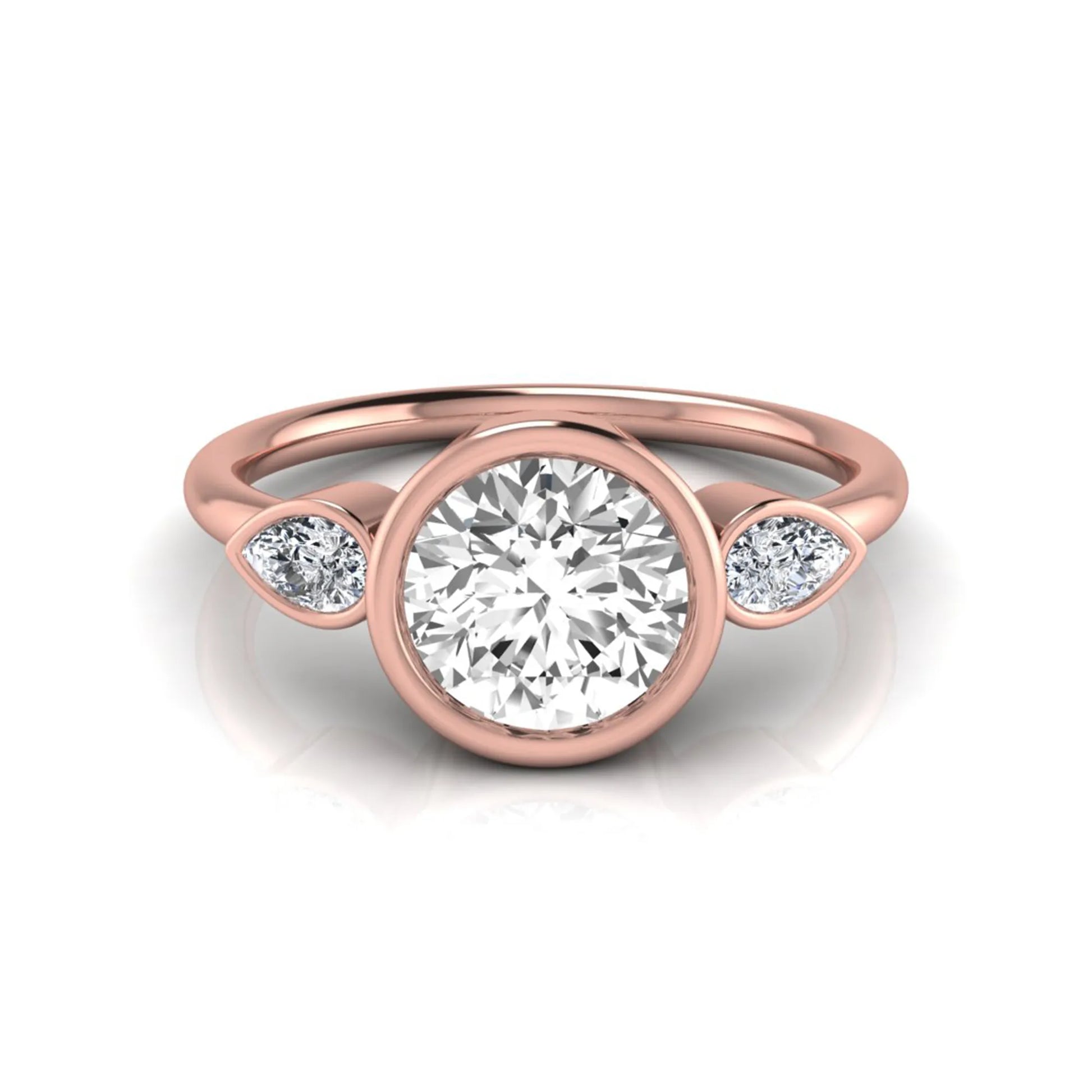 Round cut lab grown diamond bezel three stone engagement ring featuring a 1.28 carat IGI certified center diamond with pear cut side diamonds in rose gold.