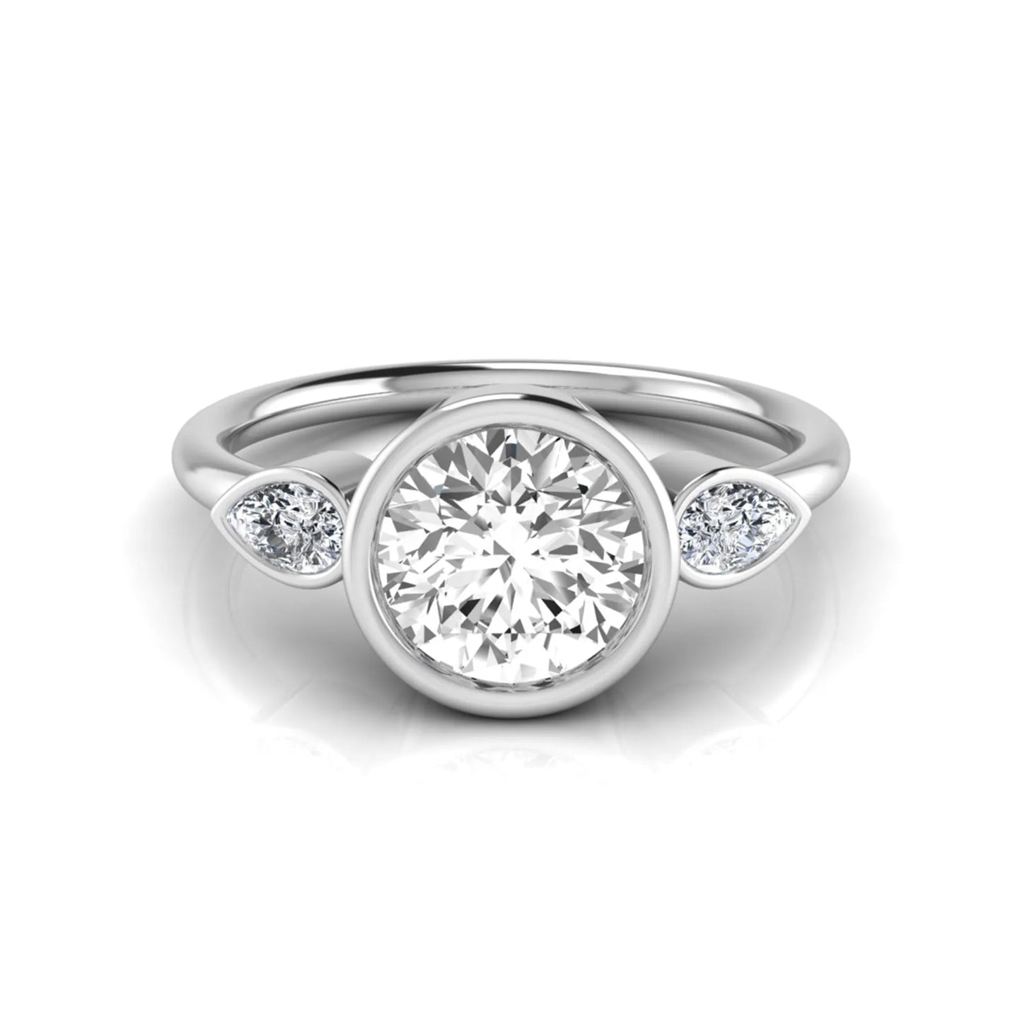 Round cut lab grown diamond bezel three stone engagement ring featuring a 1.28 carat IGI certified center diamond with pear cut side diamonds in white gold.