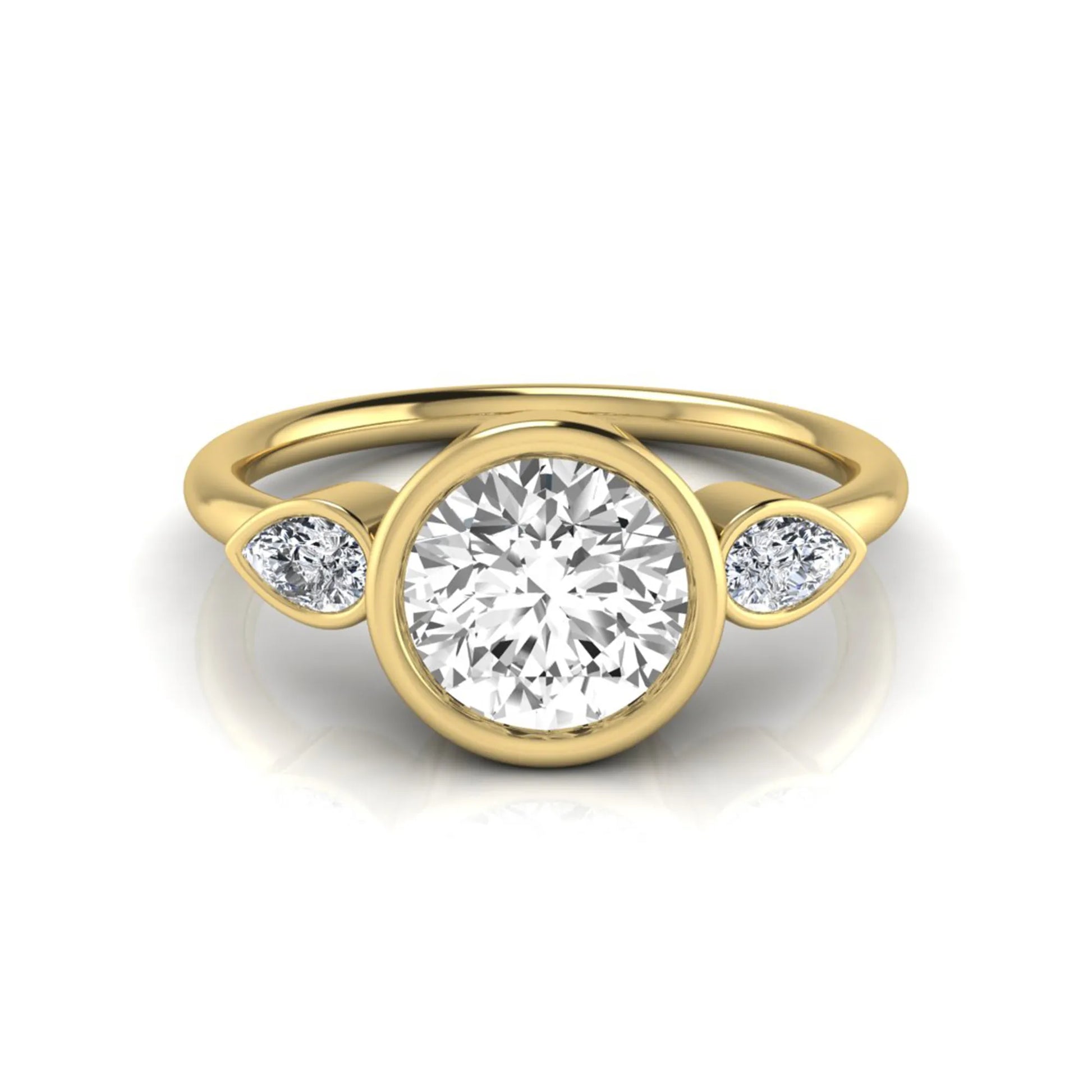 Round cut lab grown diamond bezel three stone engagement ring featuring a 1.28 carat IGI certified center diamond with pear cut side diamonds in yellow gold.