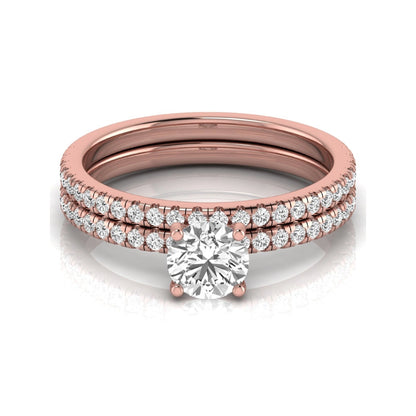 Round cut lab grown diamond bridal ring set featuring a 1.03 carat IGI certified center diamond with matching pavé diamond wedding band in rose gold.