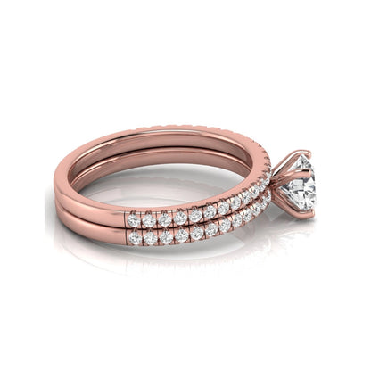 Round cut lab grown diamond bridal ring set featuring a 1.03 carat IGI certified center diamond with matching pavé diamond wedding band in rose gold.