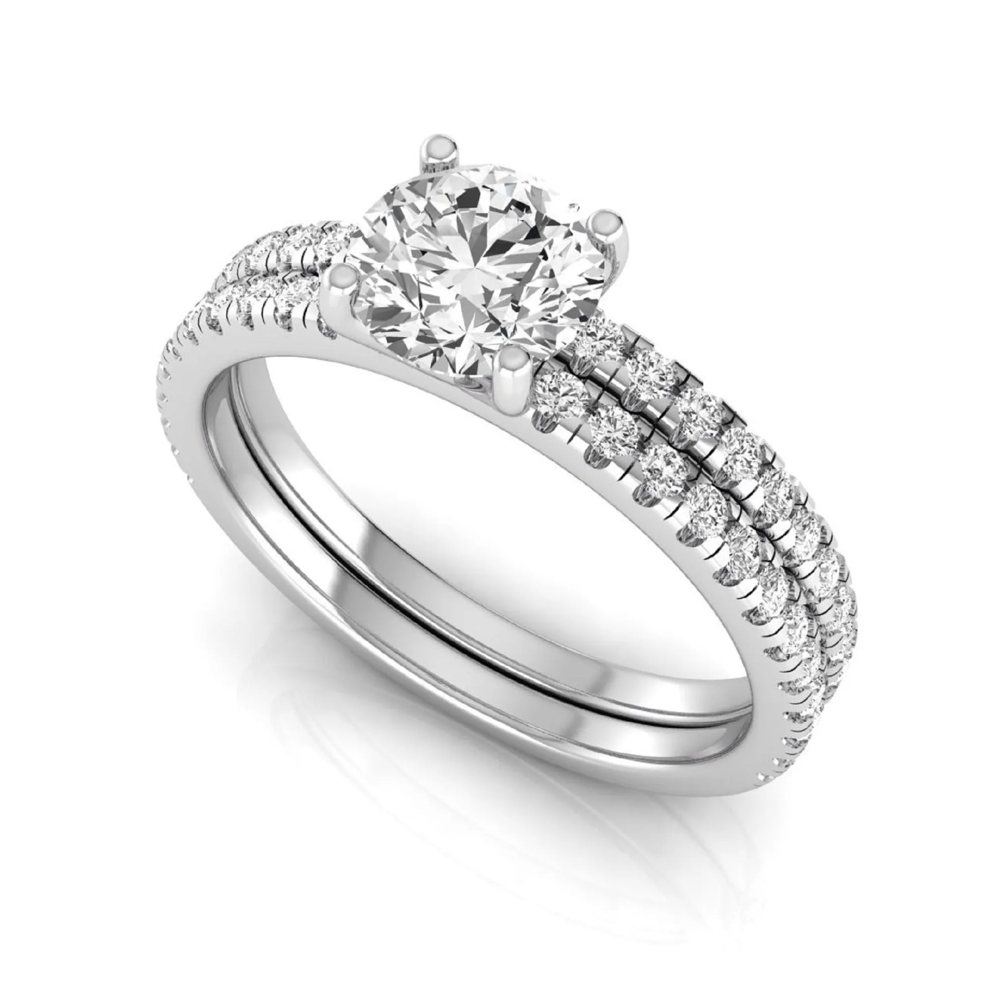 Round cut lab grown diamond bridal ring set featuring a 1.03 carat IGI certified center diamond with matching pavé diamond wedding band in white gold.
