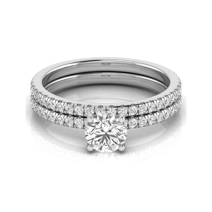 Round cut lab grown diamond bridal ring set featuring a 1.03 carat IGI certified center diamond with matching pavé diamond wedding band in white gold.