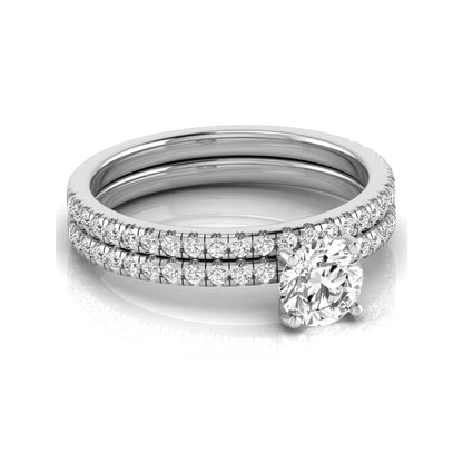 Round cut lab grown diamond bridal ring set featuring a 1.03 carat IGI certified center diamond with matching pavé diamond wedding band in white gold.