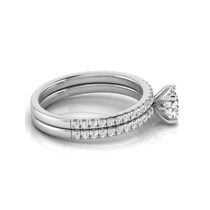Round cut lab grown diamond bridal ring set featuring a 1.03 carat IGI certified center diamond with matching pavé diamond wedding band in white gold.
