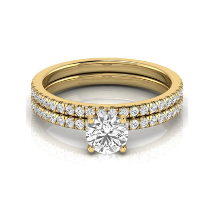 Round cut lab grown diamond bridal ring set featuring a 1.03 carat IGI certified center diamond with matching pavé diamond wedding band in yellow gold.