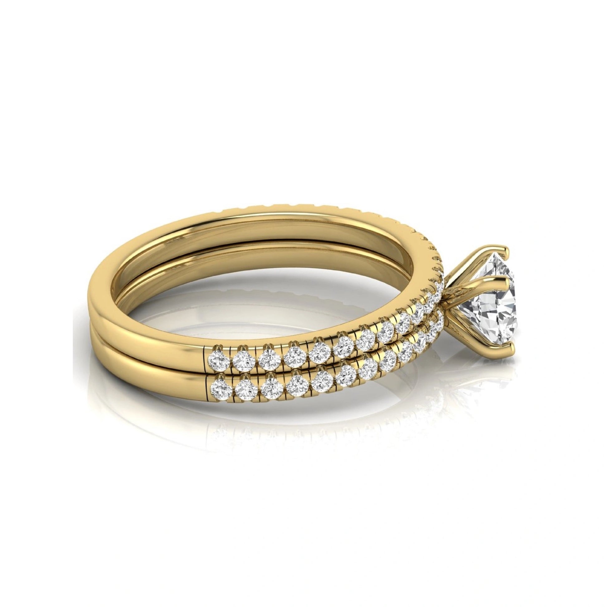 Round cut lab grown diamond bridal ring set featuring a 1.03 carat IGI certified center diamond with matching pavé diamond wedding band in yellow gold.