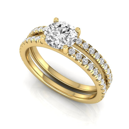 Round cut lab grown diamond bridal ring set featuring a 1.03 carat IGI certified center diamond with matching pavé diamond wedding band in yellow gold.
