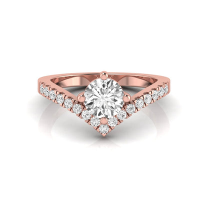 Round cut lab grown diamond engagement ring featuring a four-prong setting with a chevron pavé diamond band in rose gold tone.