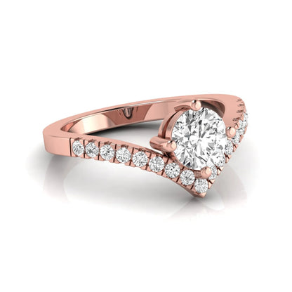 Round cut lab grown diamond engagement ring featuring a four-prong setting with a chevron pavé diamond band in rose gold tone.
