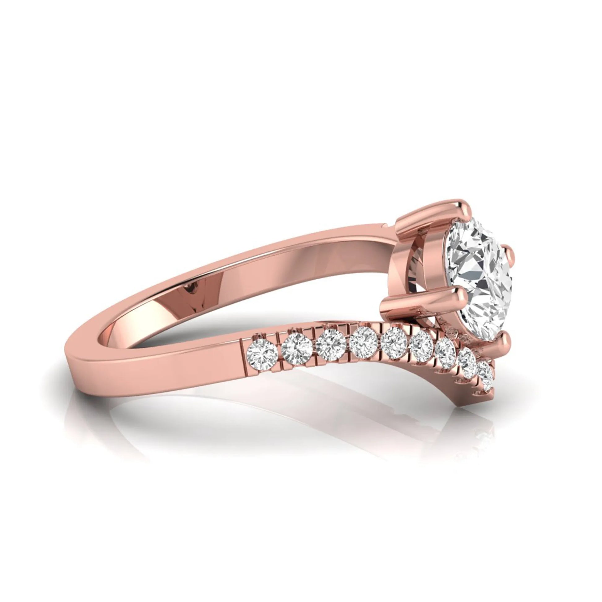 Round cut lab grown diamond engagement ring featuring a four-prong setting with a chevron pavé diamond band in rose gold tone.