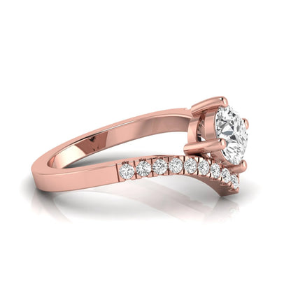 Round cut lab grown diamond engagement ring featuring a four-prong setting with a chevron pavé diamond band in rose gold tone.