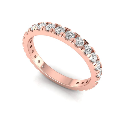 Round cut lab grown diamond full eternity band in rose gold featuring shared prong set diamonds around the entire band.