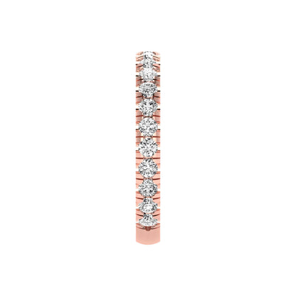 Round cut lab grown diamond full eternity band in rose gold featuring shared prong set diamonds around the entire band.