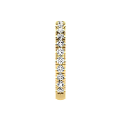 Round cut lab grown diamond full eternity band in yellow gold featuring shared prong set diamonds around the entire band.