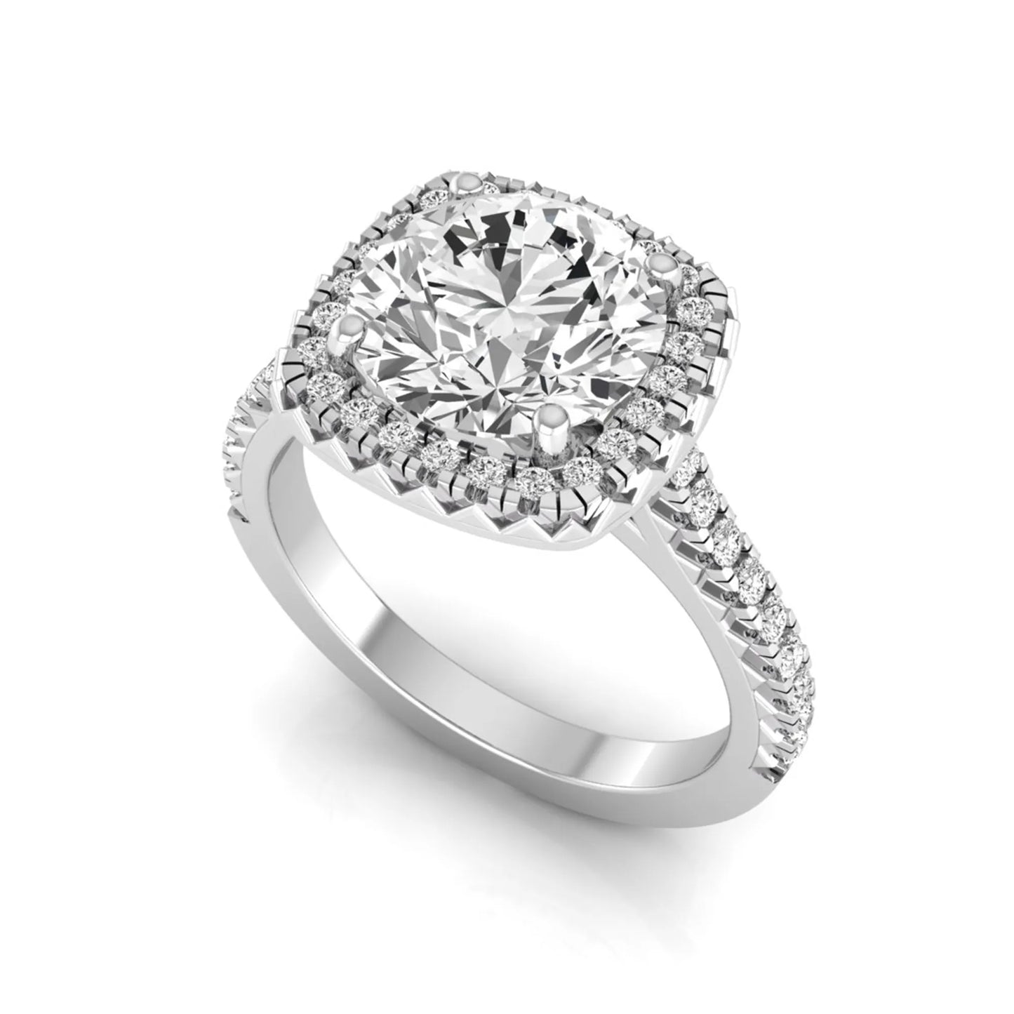Round cut lab grown diamond halo engagement ring featuring a four-prong center setting with a pavé diamond band in white gold tone.