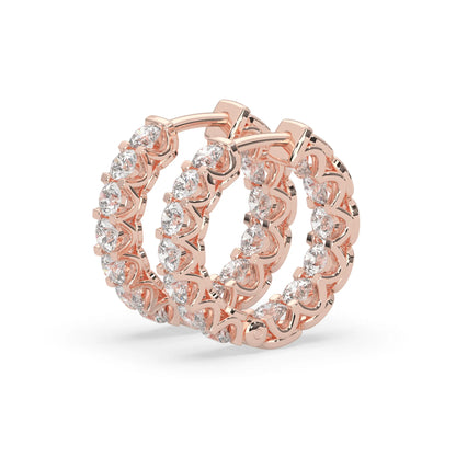 rose gold Round cut lab grown diamond hoop earrings featuring 2.50 mm diamonds in a shared prong setting with hinged closure.