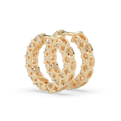 yellow gold Round cut lab grown diamond hoop earrings featuring 2.50 mm diamonds in a shared prong setting with hinged closure.