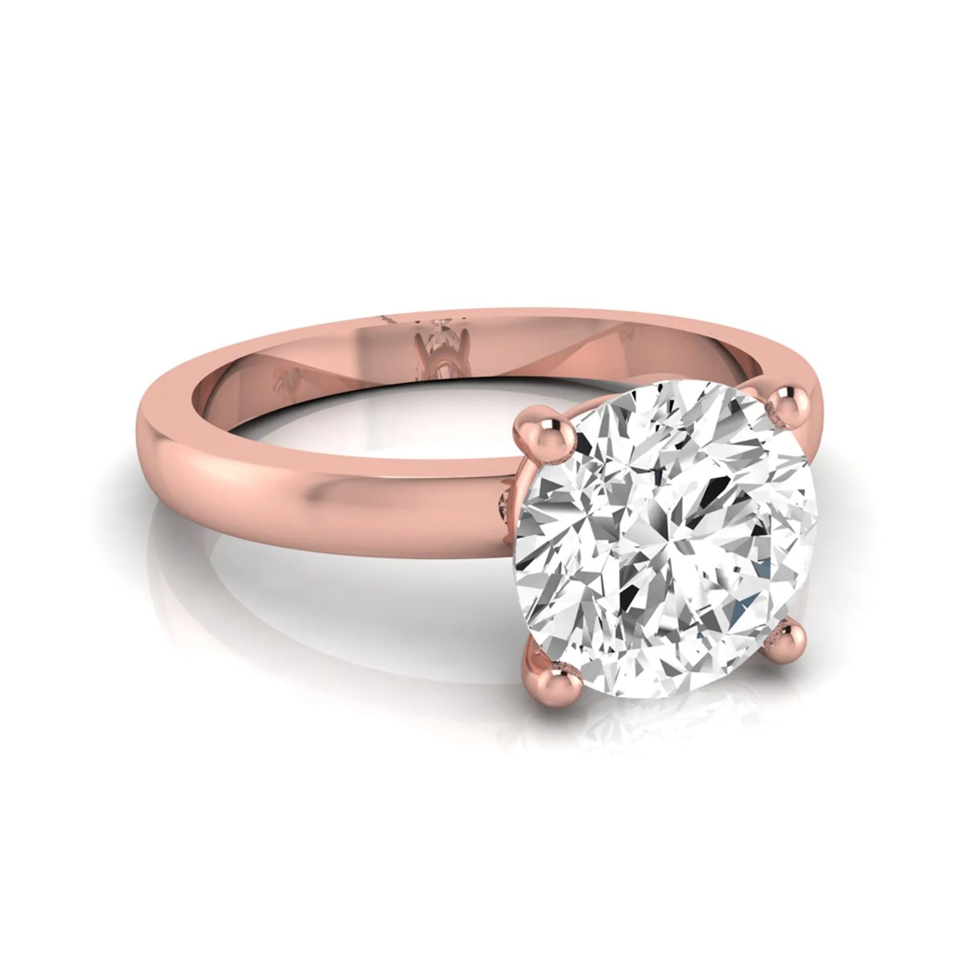 Round cut IGI certified 2.04 carat lab grown diamond solitaire engagement ring in rose gold with a classic four-prong setting.