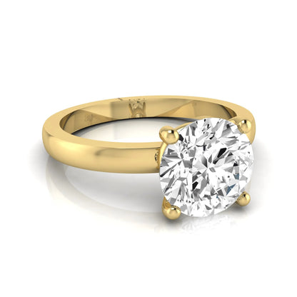 Round cut IGI certified 2.04 carat lab grown diamond solitaire engagement ring in yellow gold with a classic four-prong setting.