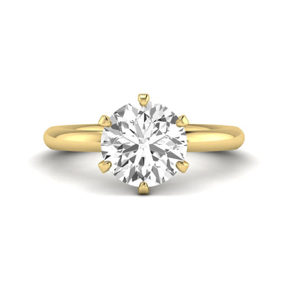 IGI certified round cut lab grown diamond solitaire engagement ring in yellow gold with a classic six-prong setting.