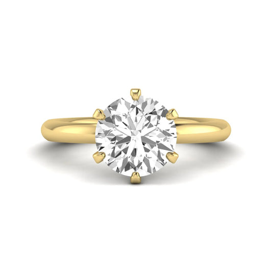 IGI certified round cut lab grown diamond solitaire engagement ring in yellow gold with a classic six-prong setting.
