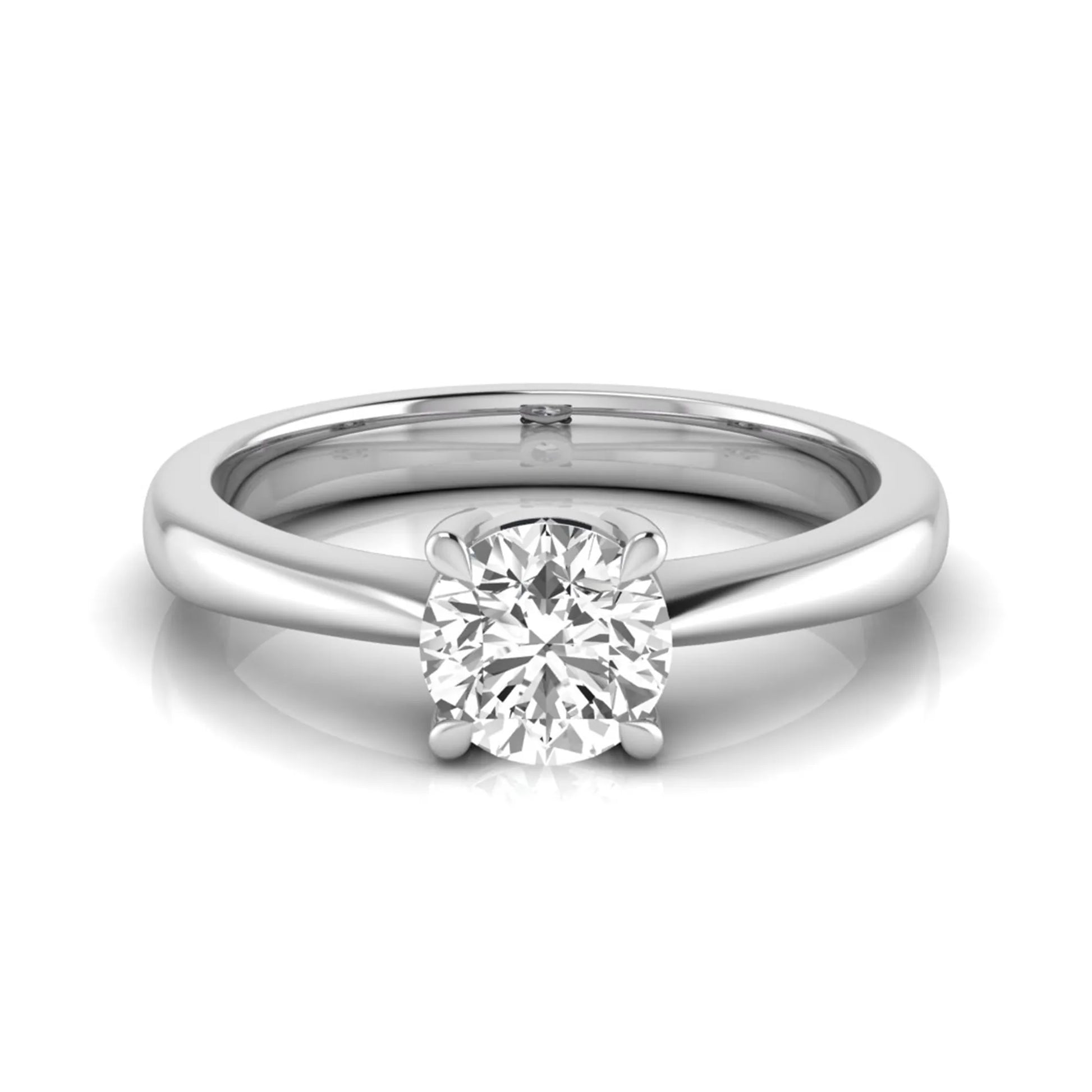 Round cut lab grown diamond solitaire engagement ring in white gold with classic four-prong setting.