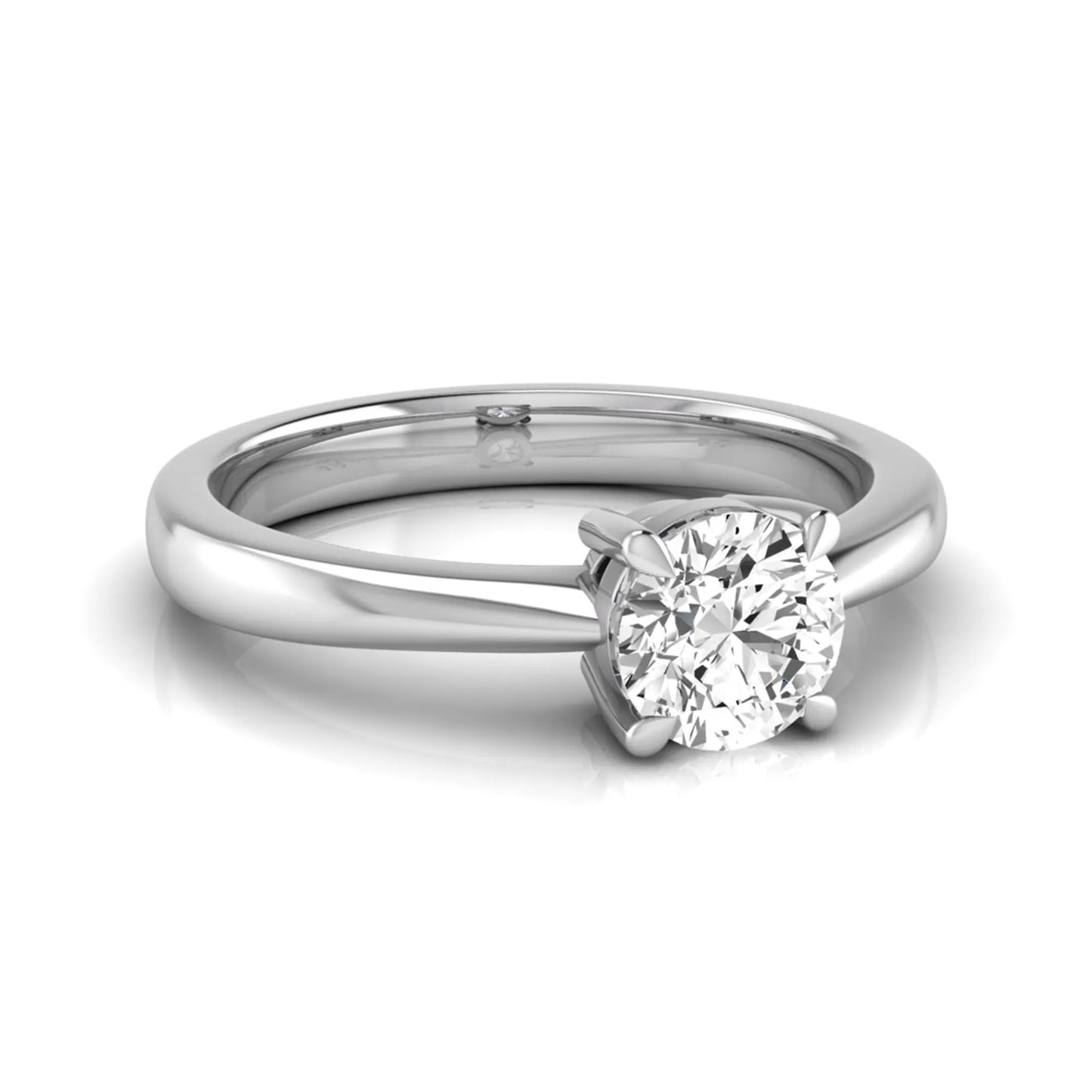 Round cut lab grown diamond solitaire engagement ring in white gold with classic four-prong setting.