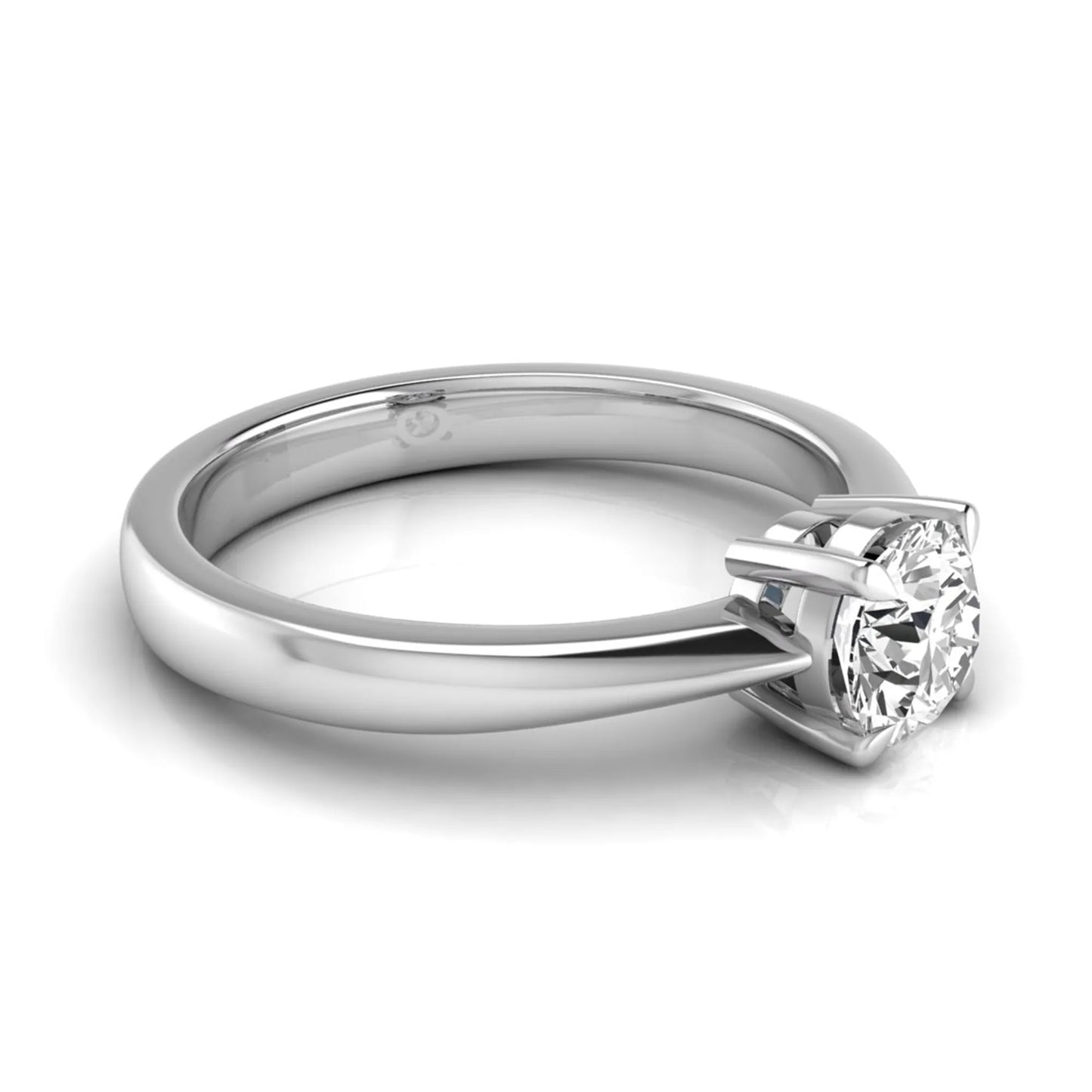 Round cut lab grown diamond solitaire engagement ring in white gold with classic four-prong setting.