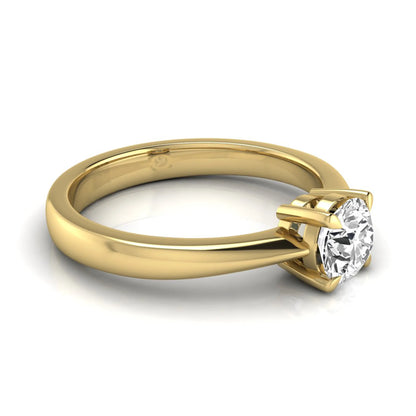 Round cut lab grown diamond solitaire engagement ring in yellow gold with classic four-prong setting.