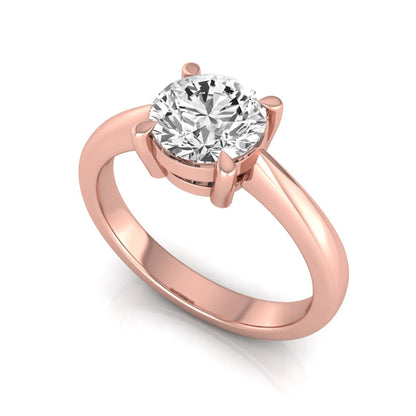 Round cut lab grown diamond solitaire engagement ring in rose gold featuring a 1.28 carat IGI certified diamond.