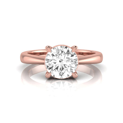 Round cut lab grown diamond solitaire engagement ring in rose gold featuring a 1.28 carat IGI certified diamond.