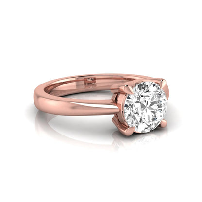 Round cut lab grown diamond solitaire engagement ring in rose gold featuring a 1.28 carat IGI certified diamond.
